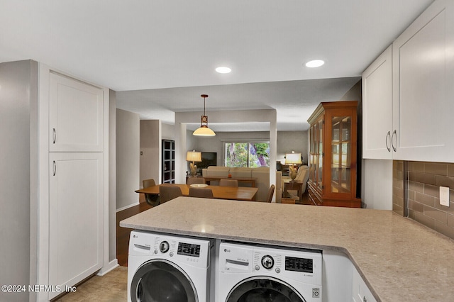 laundry area with washing machine and clothes dryer