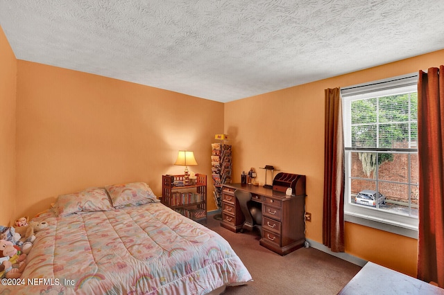 carpeted bedroom with a textured ceiling