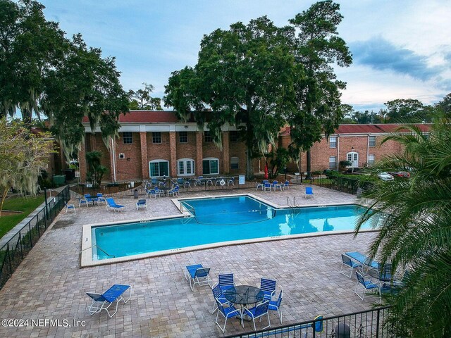 view of pool featuring a patio