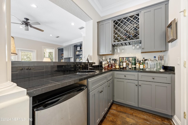 24554 Harbour View Dr, Ponte Vedra Beach, FL 32082 - indoor wet bar featuring dishwasher, crown molding, a ceiling fan, dark wood-type flooring, and recessed lighting