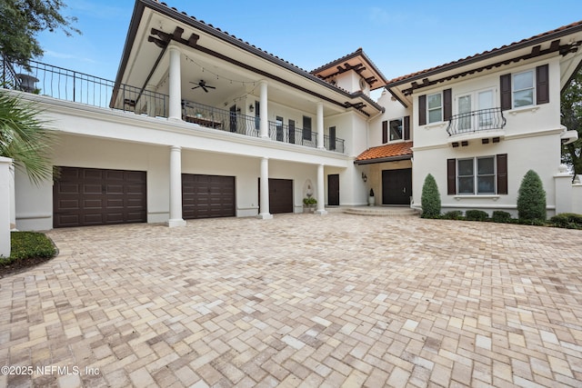 24554 Harbour View Dr, Ponte Vedra Beach, FL 32082 - view of front of home featuring a balcony, a tile roof, stucco siding, and driveway