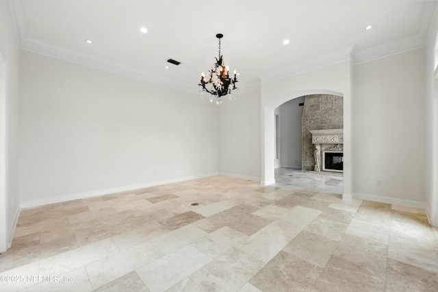 24554 Harbour View Dr, Ponte Vedra Beach, FL 32082 - unfurnished living room featuring arched walkways, a large fireplace, crown molding, a chandelier, and recessed lighting