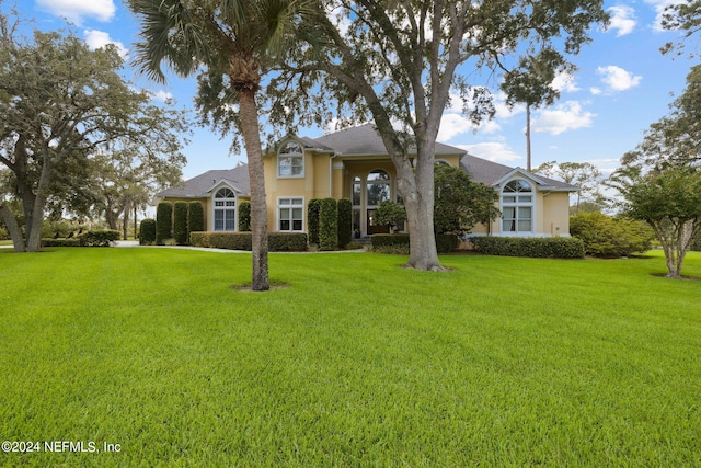 view of front of home with a front yard