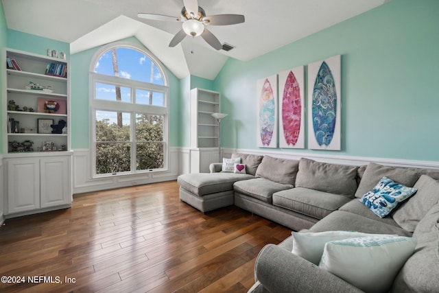 living room with dark wood-type flooring, ceiling fan, and vaulted ceiling