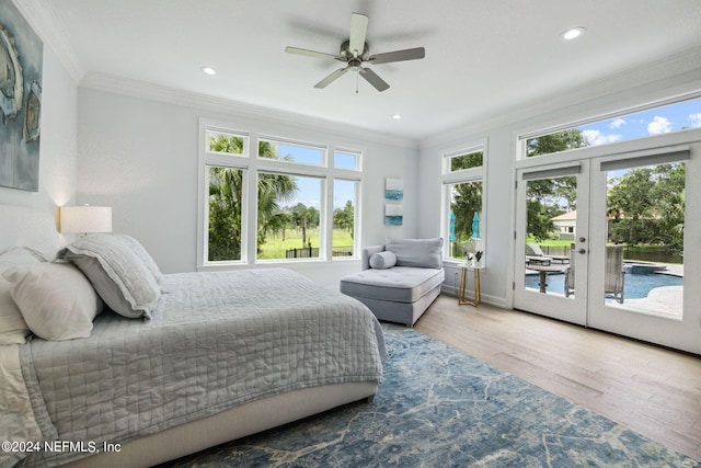 bedroom featuring crown molding, hardwood / wood-style floors, french doors, and access to outside