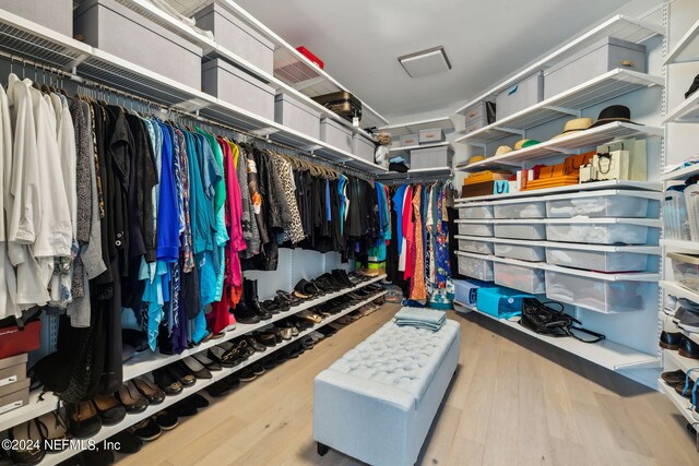 spacious closet featuring light hardwood / wood-style flooring