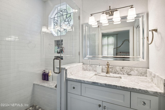 bathroom with vanity and an enclosed shower