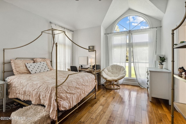 bedroom featuring wood-type flooring and lofted ceiling