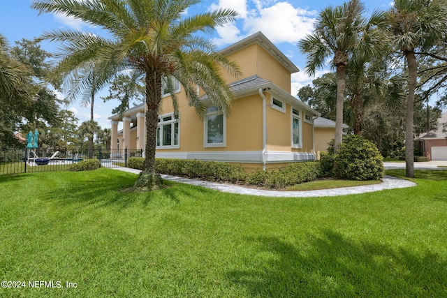 view of side of home featuring a yard