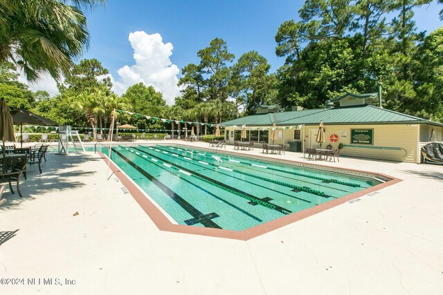 view of pool featuring a patio area and volleyball court