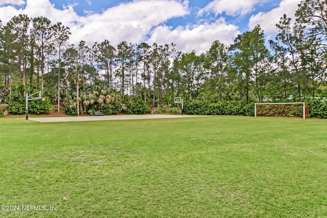 view of yard with basketball court