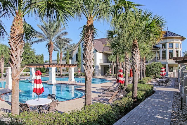 view of pool with a patio area and a pergola