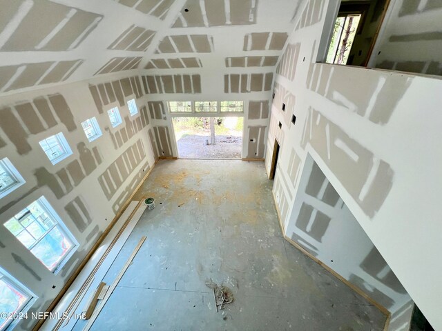 unfurnished living room featuring plenty of natural light