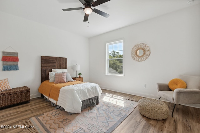 bedroom with wood-type flooring and ceiling fan