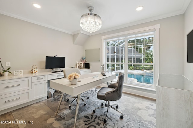 office space with a notable chandelier, ornamental molding, and light hardwood / wood-style flooring