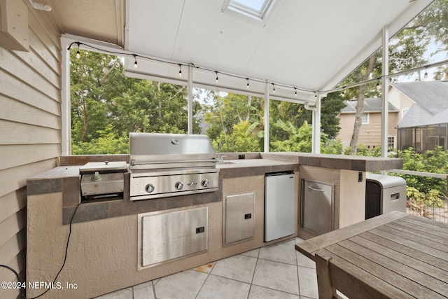 view of patio featuring area for grilling and an outdoor kitchen