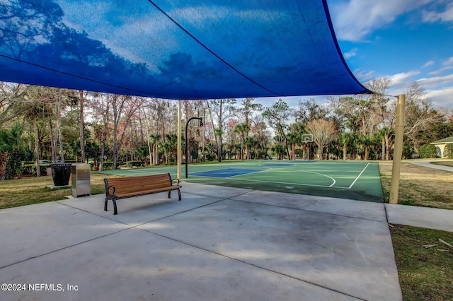 view of community with basketball hoop