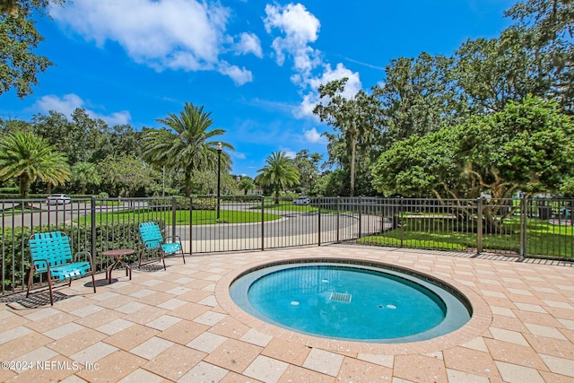 view of swimming pool featuring a patio