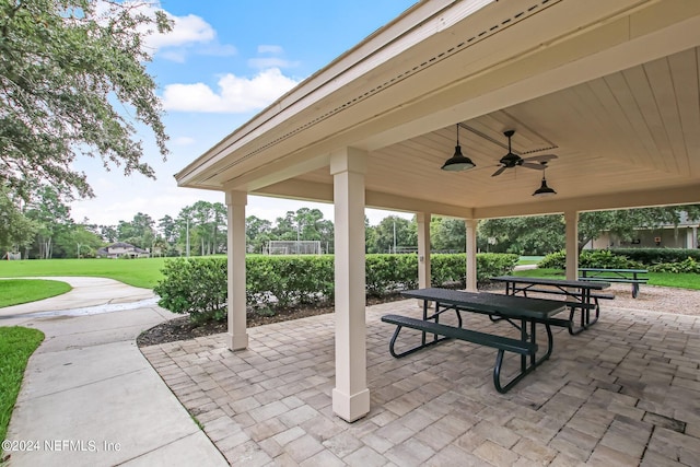 view of property's community with a lawn, a patio, and a gazebo