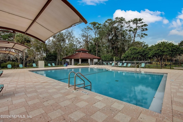 view of pool with a gazebo and a patio area