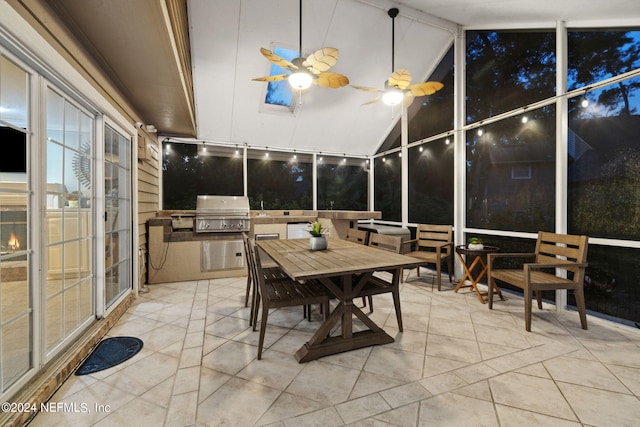 sunroom with vaulted ceiling and ceiling fan