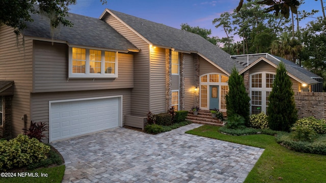 view of front of property with a garage