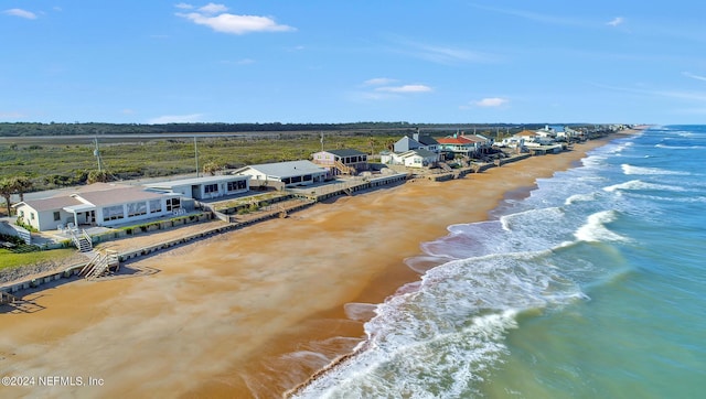 aerial view featuring a water view and a view of the beach