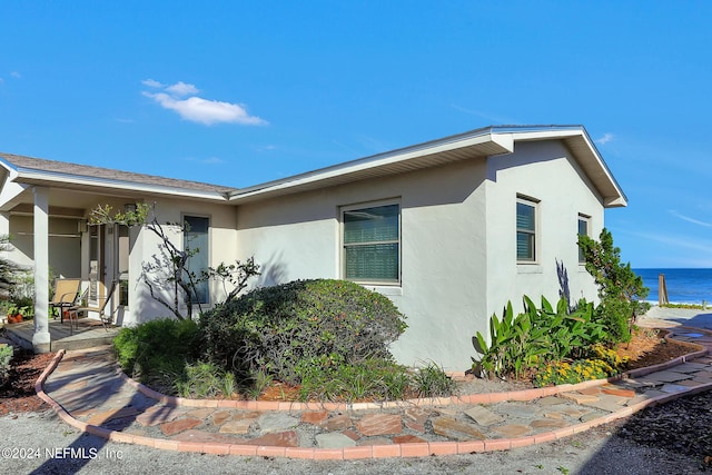 view of side of property with a water view