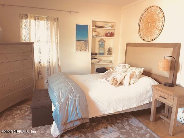 bedroom featuring ornamental molding