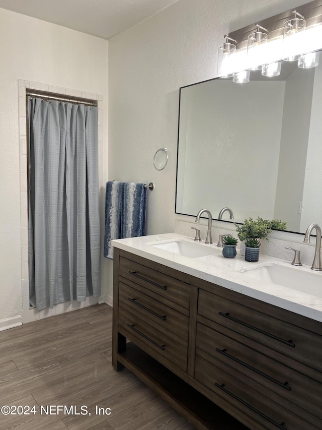 bathroom with wood-type flooring and vanity