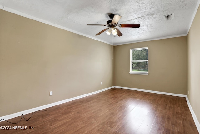 spare room with crown molding, ceiling fan, wood-type flooring, and a textured ceiling