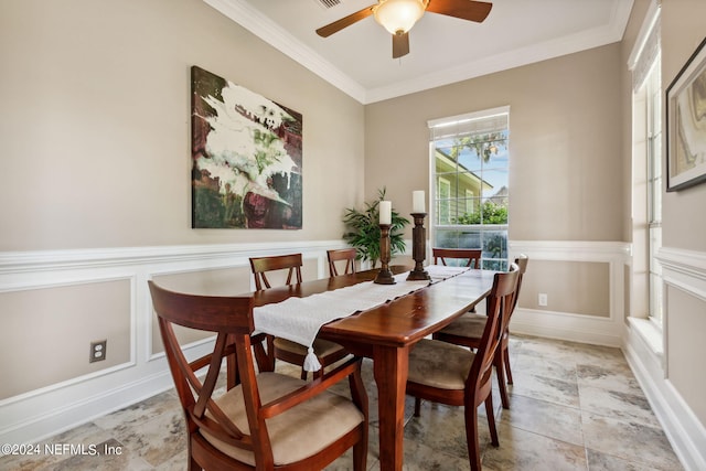 dining room with ornamental molding and ceiling fan