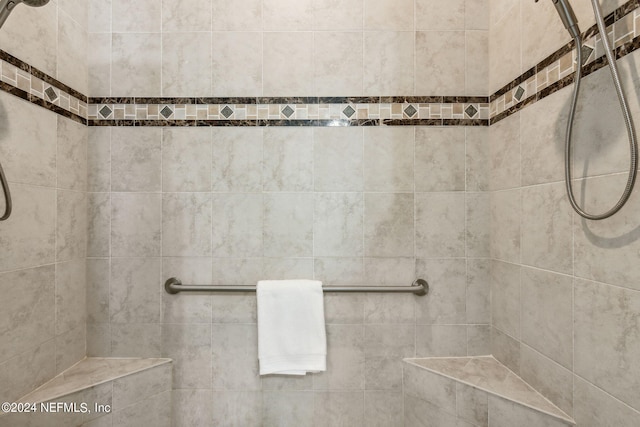 bathroom with tiled shower