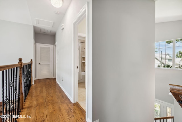 corridor featuring light hardwood / wood-style floors