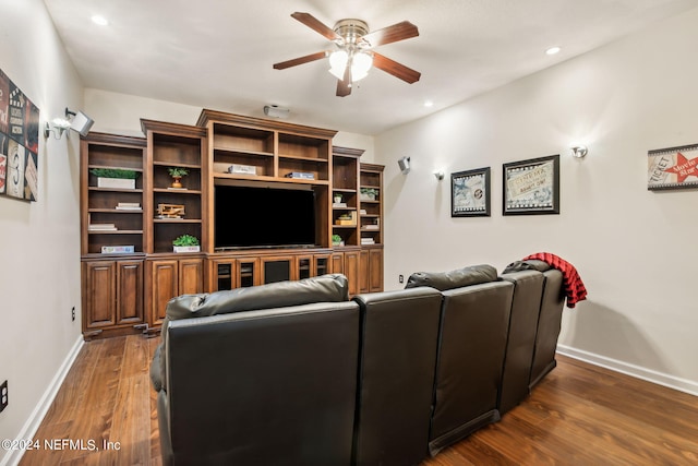 living room featuring dark hardwood / wood-style floors and ceiling fan