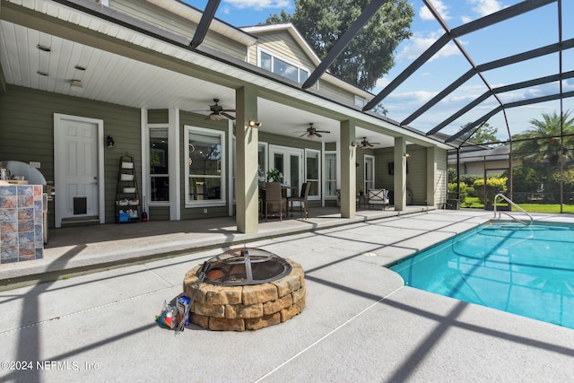 view of pool featuring a patio, ceiling fan, and an outdoor fire pit