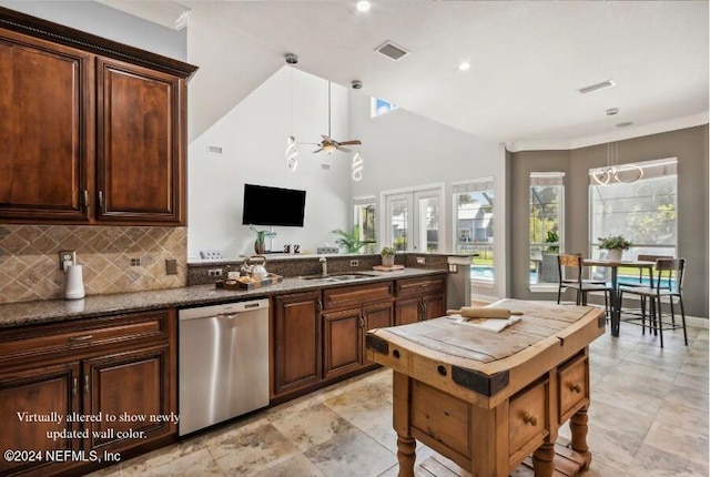 kitchen with sink, backsplash, stainless steel dishwasher, ceiling fan, and kitchen peninsula