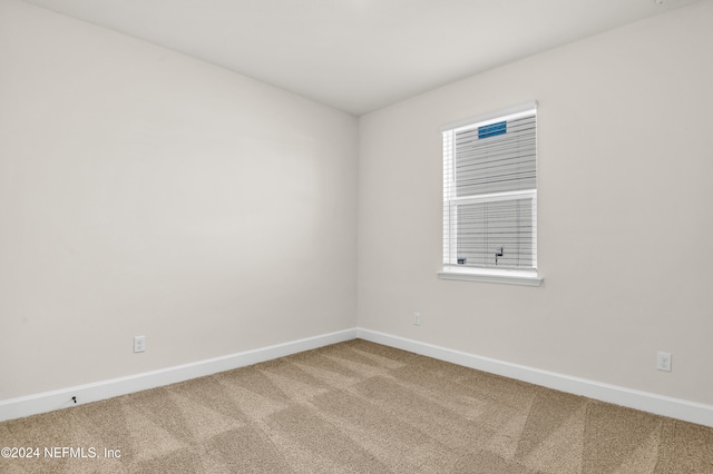 unfurnished room featuring carpet floors