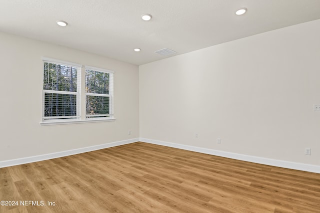 unfurnished room featuring light hardwood / wood-style floors