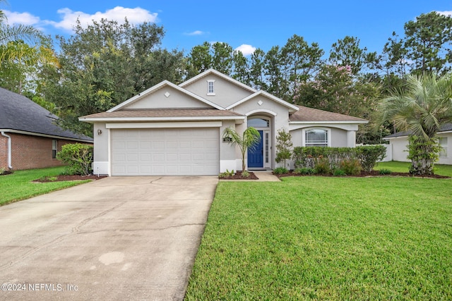 ranch-style home with a garage and a front lawn