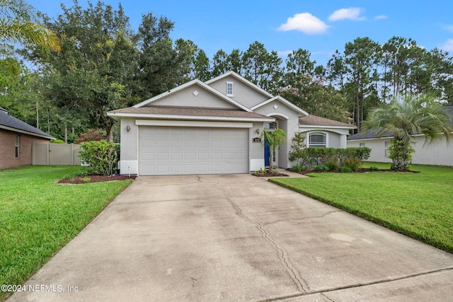 view of front of home featuring a garage and a front yard