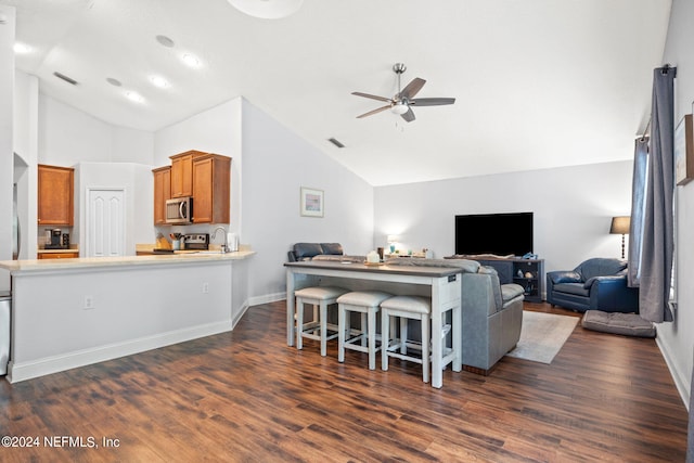 living room featuring dark wood-type flooring, ceiling fan, and high vaulted ceiling