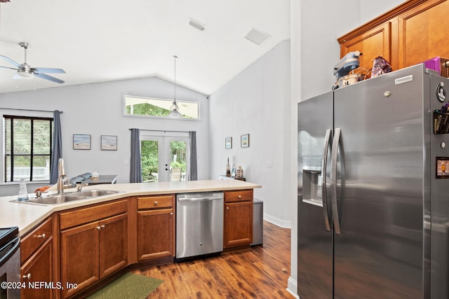 kitchen with french doors, lofted ceiling, sink, dark hardwood / wood-style flooring, and stainless steel appliances