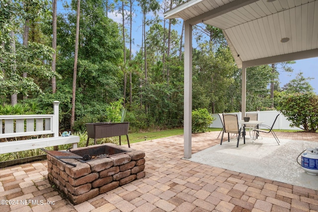 view of patio / terrace with an outdoor fire pit