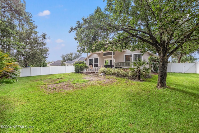 view of yard with a deck