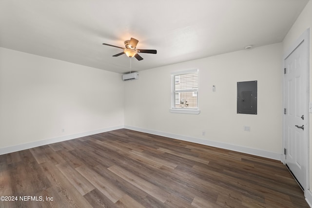 unfurnished bedroom featuring hardwood / wood-style flooring, a wall mounted AC, electric panel, and ceiling fan