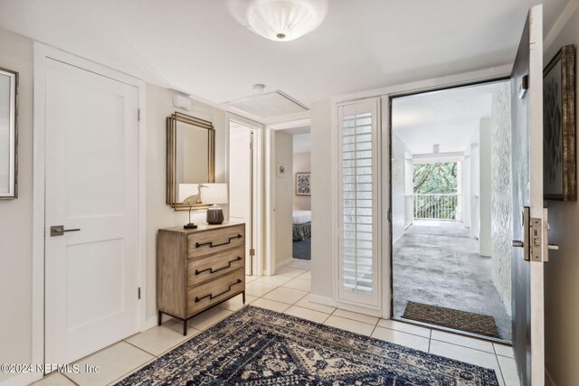 interior space with vanity and tile patterned flooring