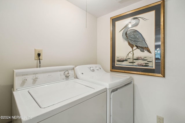 laundry room with independent washer and dryer