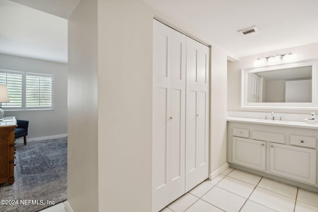 bathroom with vanity and tile patterned flooring