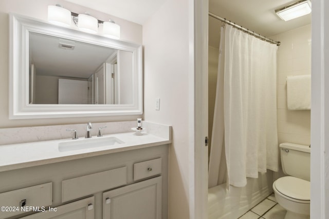 full bathroom with vanity, toilet, shower / bath combo, and tile patterned flooring